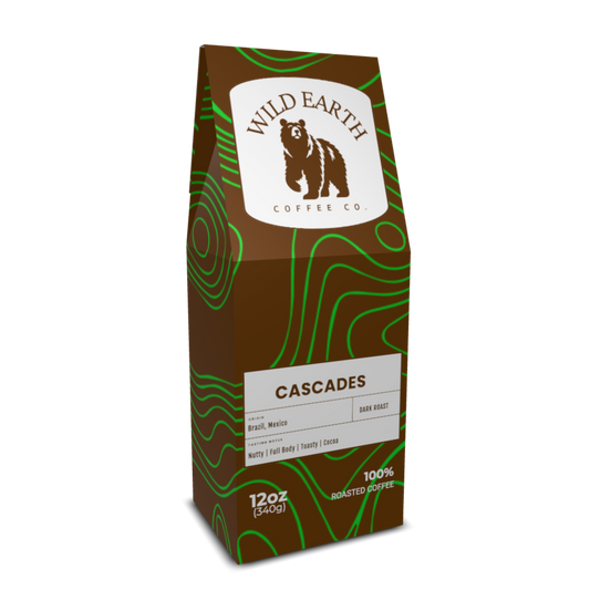 Wild Earth Coffee Co. Cascades coffee bag on a brown bag. A brown bear logo is on a white background